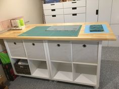 a workbench with drawers and cutting mat on the counter top in an office