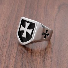 Presenting this Knights Templar Commandery Ring in durable stainless steel, showcasing a bold black and silver design. This emblematic ring symbolizes the strength and heritage of the esteemed order, a striking statement of commitment and honor. Metals Type: Stainless Steel Surface Width: 20mm Ring Face: 1.9cm*1.64cm Weight: 13g We ship worldwide to 185 countries! Please allow 1-2 business weeks for your order to arrive. Iron Cross Ring, Steel Armor, Silver Knight, Iron Cross, Steel Gifts, German Army, Cross Ring, Bold Black, Knights