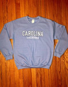 8 oz 50/50 cotton/poly Carolina Lacrosse Crew Sweatshirt unisex sizing Lacrosse Sweatshirt, Lacrosse Hoodie, Hockey Hoodie, College Sweater, Lacrosse Girls, Blue Crew, Field Hockey, Baltimore Md, Girl Sweatshirts