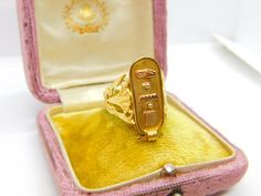 Details: A fantastic and wonderfully designed antique art deco Egyptian 21ct yellow gold hieroglyphic ingot form signet ring hallmarked to the interior band and XRF tested c1920. This is a wonderful item that would make a perfect gift or addition to any collection. The BOX pictured is for PRESENTATION ONLY and is NOT included in the listings but used to frame the pictures unless specifically stated otherwise.  Condition Report: The item is in good condition, all our items are quality conditioned Antique Gold Rectangular Rings, Antique Gold Engraved Rectangular Ring, Antique Rectangular Gold Rings, Gold Oval Signet Ring In Art Deco Style, Art Deco Engraved Signet Ring, Gold Art Deco Jewelry For Ceremonial Occasions, Gold Art Deco 14k Gold Signet Ring, Oval Art Deco Signet Ring As Gift, Gold Art Deco Signet Ring For Anniversary