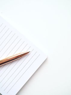 a pen sitting on top of a piece of paper