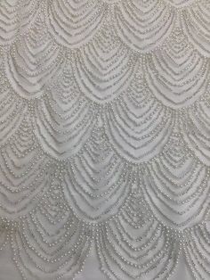 We offer a variety of fashion handmade fabric，those are widely use for wedding dress，garment and fashion cloth. we sell it by yard，our minimum order is 1 yards，and we always package it 15 yards for one roll，the width is about 130cm/51 inch Material ： mesh ，Rayon,polyester. Symmetrical embroidery floral pattern, with lovely flowers in the middle, scalloped border. You can also cut and use separately. Perfect for dress, tops, wedding veil. You can split the piece up and have one scalloped edge aro Pearl Fabric, Lace Material Fabrics, Beaded Lace Embroidered Fabric For Banquet, Elegant Sequin Fabric With Pearl Embroidery For Banquet, Elegant Fitted Beaded Tulle Fabric, Elegant Fitted Tulle Fabric With Pearl Embroidery, Elegant Beaded Tulle Fabric, Elegant Beaded Lace Embroidered Fabric, Elegant Lace Fabric With Pearl Embroidery