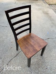 a wooden chair sitting on top of a sidewalk