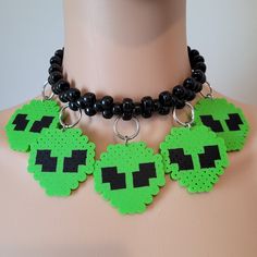 These kandi necklaces are made with pony beads and alien charms. One size fits all. This Item adjust up to 17 Inches.  This Item is made to order. Perfect for any event! You will get lots of compliments in this unique wearable art! Stand out at your next event! Edm festival  Raves Party  Rave outfit  Festival outfit Pride Handmade Adjustable Choker For Cosplay, Rave Jewelry For Halloween Party, Handmade Rave Jewelry For Party, Rave Jewelry For Music Festival With Adjustable Fit, Rave Style Beaded Jewelry For Festivals, Rave Beaded Jewelry For Festivals, Handmade Rave Jewelry For Halloween, Adjustable Rave Style Choker, Adjustable Rave Choker For Festival