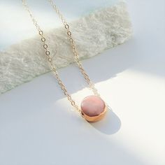 Gorgeous marble pink porcelain necklace dipped in gold. Lightweight and very comfortable, you won't feel that you are wearing anything at all. 14 k gold filled chain is high quality - safe for most people with allergies and doesn't change colour after time. Unique design and great idea for gift.It takes long time to achieve final results - each porcelain jewelry piece is finished with gloss glaze and hand-painted with 24 k gold luster, fired 3 times total. Please note that each pair might be sli Delicate Pink Gold Pendant Jewelry, Minimalist Pink Gold Necklace For Gift, Minimalist Pink Pendant Necklace, Delicate Rose-colored Pendant Necklace, Minimalist Rose Quartz Pendant Necklace, Marble Pink, Pink Porcelain, Porcelain Necklace, Jewelry Store Design