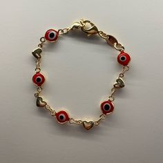 Gold Layered Fancy Bracelet. Great Bracelet For Girls. Greek Eye And Heart Design. Resin Finish. Measures: 6.0 X 0.3 X 0.1 In Weight: 3.5 G. Thickness: 07 Mm Thickness. Evil Eye Bracelet Red, Red Evil Eye Bracelet, Red Evil Eye, Fancy Bracelet, Greek Eye, Bracelet For Girls, Kids Accessories Jewelry, Eye Bracelet, Evil Eye Bracelet