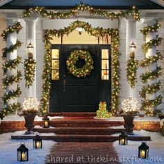 the front door is decorated for christmas with wreaths and lights