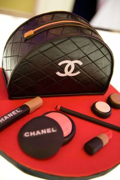 a chanel bag cake with makeup and lipstick