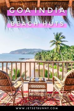 two chairs sitting on top of a patio next to the ocean with text overlay reading goandia beach huts