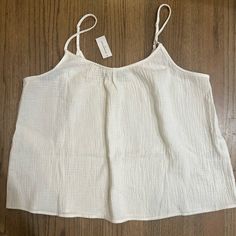 Nwt Banana Republic White Tank-Size Large. Perfect To Wear By Itself Or Under A Nice Sweater Or Blazer. White Cotton Chic Camisole, Chic White Cotton Camisole, Summer Beach White Camisole, Cream Camisole Top For Beach, White Cotton Summer Camisole, White Relaxed Fit Tank Top For Beach, White Summer Camisole For Vacation, Cotton Cami Tank Top For Daytime, Cream Cotton Vacation Tops