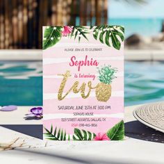 a pink and gold birthday party with pineapples, flowers and palm leaves is next to a pool