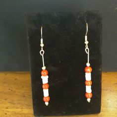 Handmade peppermint stick style earrings Red glass beads and white shell beads Silver fishhook Peppermint Sticks, Fish Hook, Shell Beads, White Beads, Beaded Dangles, Red Glass, Peppermint, Red And White, Jewelry Earrings Dangle