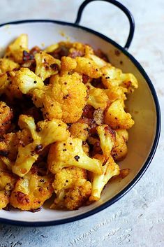 cooked cauliflower in a bowl on a table