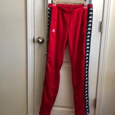 Size Medium! Never Worn. Red Kappa Pants Casual Fitted Red Bottoms, Casual Fitted Red Pants, Fitted Red Bottoms With Elastic Waistband, Red Bottoms With Elastic Waistband, Casual Red Tapered Leg Bottoms, Red Fitted Casual Pants, Sporty Red Pants With Elastic Waistband, Red Fitted Bottoms For Loungewear, Full Length Red Pants With Elastic Waistband