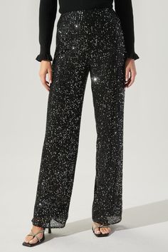 Be the dancing queen in these funky fun pants. These sequin covered pants feature a high waist with a wide leg, giving off the look of lengthy legs. Pair it with a satin blouse and platform heels for a groovy look.- High waist- Wide leg- Fully lined - Invisible Zipper- Comes in 2 colorsSize + Fit - Model is 5'10" and wearing size XS- Measurements taken from size S - Waist: 27"- Inseam: 34 1/4" Fabric Self:100% Polyester, Lining: 100% Polyester Style Number STP7089DRA Friday Nights, Ruffle Jumpsuit, Sequin Pants, One Shoulder Jumpsuit, Romper Suit, Anthropologie Brands, Fun Pants, Crochet Halter Tops, Flowy Pants