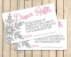 two snowflake diaper raf cards on wooden background with text that reads diaper rollle