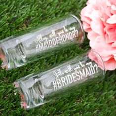 two bridesmaid wine glasses sitting on the grass