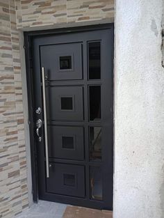 a black door with glass inserts on the side