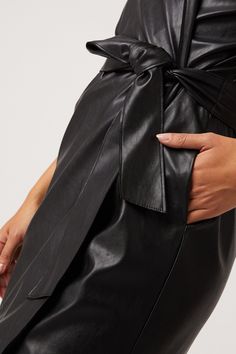 Our Robin Vegan Leather Dress, is a sultry trench dress that signifies everything chic. This bold black mini has 3/4 length sleeve detail, is made of our Vegan Leather with Japanese Technology, and hits above the knee in length. 100% Vegan Leather - 100% Polyurethane Dry Clean Only Made in USA Model is 5'11 and wearing size S Fitted Leather A-line Dress, Chic Knee-length Faux Leather Dress, Chic Knee-length Leather Mini Dress, Luxury Leather Mini Dress, Chic Style, Japanese Technology, Chic Faux Leather Button-up Dress, Trench Dress, Leather Dress, Black Mini