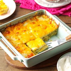 a casserole dish with cheese and sour cream