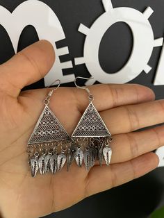 One Pair Hmong Silver Earrings,Vintage Earrings,Lantern Design,Miao Silver ,Tribal Jewelry ,Boho Style. This earrings is handmade craft by our family lived in minority area Southwest of China. It's very unique. Also can bring you much luck. It's special workmanship. It can be a special gift. Width: 2cm Height:5cm Weight: 10g Care Instruction:  ❥. Avoid wearing the same miao silver jewelry for a long time.Take off your jewelry before bathing or swimming. ❥. Miao silver jewelry should avoid rubbing against each other and scratch the flower surface. ❥. Use soft brush or cotton cloth to wipe the surface of jewelry, so as to remove surface stains. ❥. When not wearing, it should be sealed and packed to reduce contact with air and avoid oxidation of miao silver jewelry. ❥. When there is oxidation Hmong Modern Jewelry, Miao Silver, Vintage Earring, Lantern Design, Silver Ornaments, Jewelry Boho, Boho Stil, Earrings Vintage, Vintage Earrings