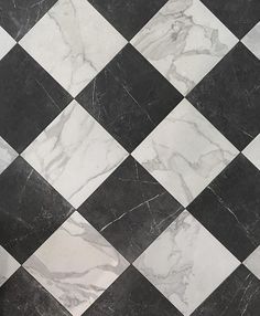 a black and white checkered floor with marble