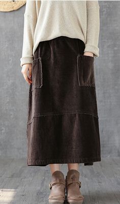 Casual Cotton loose fitting Women's Skirts Casual Winter Skirt With Pockets, Baggy Cotton Knee-length Skirt, Baggy Knee-length Cotton Skirt, Baggy Solid Skirt For Fall, Solid Color Relaxed Fit Skirt For Fall, Solid Relaxed Fit Skirt For Fall, Relaxed Fit Skirt With Pockets For Fall, Winter Cotton Skirt With Pockets, Solid Color Tiered Skirt With Pockets