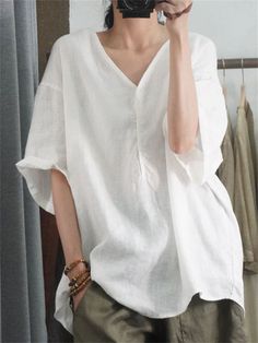 Description Product ID: TP2051855 Material: Cotton, Linen, Polyester Pattern: Solid Closure: Pullover Sleeve: Short Sleeve Season: Summer Style: Fashion, Casual, Simple Occasion: Picnic, Holiday, Daily Package included 1 * Shirt Size Chart (Asian Size) Please allow 1-3 cm measured error. Size Length Chest Sleeve Length M 69cm | 27.2 in 112cm | 44.1 in 19cm | 7.5 in L 70cm | 27.6 in 116cm | 45.7 in 20cm | 7.9 in XL 71cm | 28.0 in 120cm | 47.2 in 21cm | 8.3 in XXL 72cm | 28.3 in 124cm | 48.8 in 22 Solid Color V-neck Shirt For Beach, Oversized V-neck Shirt For Summer, Casual Plain Tops For Beach, Solid Color Summer Tunic Top, Casual Relaxed Fit Tunic Tops, Casual V-neck Plain Blouse, Casual Oversized Tunic Top, V-neck Relaxed Fit Plain Blouse, Relaxed Fit V-neck Plain Blouse