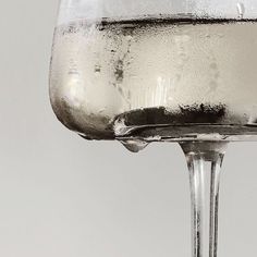 a glass filled with water on top of a table