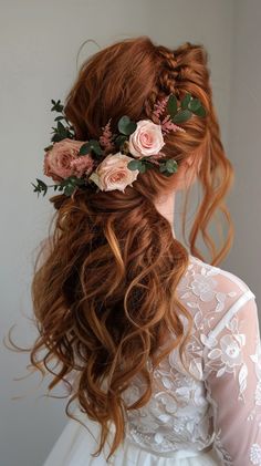 a woman with long red hair and flowers in her hair is wearing a wedding dress