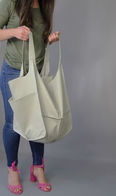 "Leather hobo purse Hobo bag Classic slouchy hobo purse beige leather Soft Natural Leather Large Capacity Every Day Bag Weekender bag Light grey oversized bag - large leather tote bag. Unikque model. Large and stylish tote bag made from high quality leather. Spacious interior provides room for all the daily essentials and more. It is large enough to hold all your weekend essentials. This bag is perfect as your everyday bag, which can fit an IPAD, A4 files, books, magazines, cosmetic bag as well Beige Hobo Bucket Bag For Everyday, Everyday Beige Hobo Bucket Bag, Daily Use Hobo Bag With Pockets, Cream Hobo Bag For Everyday Use, Beige Hobo Bag For Everyday, Travel Canvas Hobo Bag With Pockets, Versatile Cream Hobo Bag For Everyday Use, Beige Hobo Bucket Bag With Large Capacity, Large Capacity Beige Hobo Bucket Bag