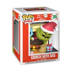 the grinch with bag pop vinyl figure is in its christmas box, wearing a santa hat