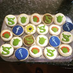 cupcakes decorated with letters and symbols on a tray