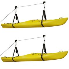 two yellow kayaks with black straps attached to them