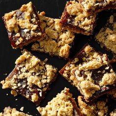 a black plate topped with brownies covered in crumbled toppings