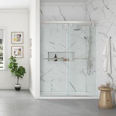 Stylish and sophisticated, the Toledo soft-close, sliding shower door is sure to add a touch of luxury to your bathroom space. The door panels have a modern frameless design with oversized horizontal bar handles, aluminum top track and profiles, and clear 5/16-in (8mm) thick tempered glass panels that open both ways in a bypass sliding motion. The easy-clean Toledo shower doors are available in widths of 48-in and 60-in, and can be purchased in either polished chrome, satin nickel or matte black Shower Door Privacy, Bathroom Redecorating, Bathroom Shower Panels, Full Bathroom Remodel, Frameless Sliding Shower Doors, Satin Nickel Hardware, Shower Wall Panels, Guest Bathrooms, Bathroom Remodel Designs