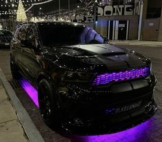 a black car with purple lights on it