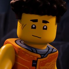 the lego movie character is wearing an orange shirt