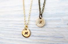 "\"Initial Disc\" A solid brass disc charm will be personalized with a hand stamped initial of your choice (please specify at checkout if you would prefer uppercase or lowercase). It is attached to a fine gold-plated chain with a lobster clasp closure. Very minimal and perfect for everyday wear! The default font for this listing is uppercase Handwritten. Available fonts shown in the last photo. ☀Charm Diameter: 10mm (3/8\") tall ☀Necklace length: 18\" (if you would prefer a different length, ple Dainty Engraved Brass Charm Necklaces, Everyday Nickel Free Brass Charm Necklaces, Everyday Brass Charm Necklace Nickel Free, Everyday Handmade Brass Charm Necklaces, Everyday Stamped Round Disc Charm Necklaces, Everyday Stamped Round Disc Charm Necklace, Minimalist Stamped Adjustable Charm Necklaces, Minimalist Stamped Charm Necklace, Dainty Hand Stamped Round Charm Necklace