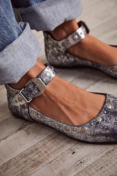 Slip into these so chic flats featured in a buttery soft leather with an adjustable ankle strap, stunning studded details, and a classic round toe. * Flat-sole style * Cushioned footbed * Adjustable buckle closure **Fit:** This style runs true to size, if in between sizes; we suggest sizing up.