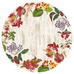 a white plate with colorful berries and leaves on the rim, in front of a wooden background