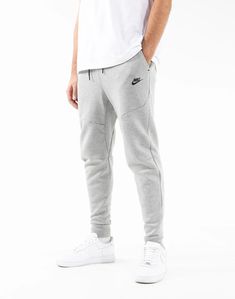 Gray Sports Pants With Ribbed Cuffs, Nike Urban Sports Bottoms, Nike Joggers For Sports, Urban Gray Sweatpants For Sports, Urban Style Gray Sweatpants For Sports, Athleisure Sportswear Bottoms With Double-needle Hem, Athleisure Bottoms For Sports With Double-needle Hem, Urban Gray Joggers For Sports, Urban Sweats With Pockets For Sports