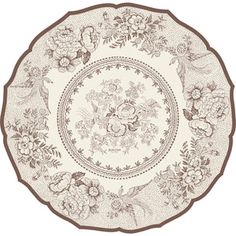 a brown and white plate with flowers on it