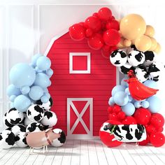 there are many balloons in the shape of farm animals and a red barn on the wall