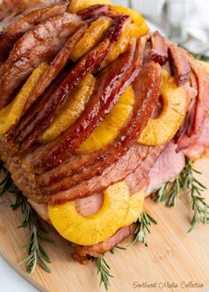 sliced ham and pineapple on a cutting board