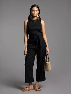 Style Description: Jumpsuit Crew neckline Tie waist detail Measurements for a size small: Chest: 17" Rise: 11" Inseam: 24.5" Fabric Content/Care: 52% Linen 46% Rayon 2% Spandex Machine Wash ColdImport Chic Black Jumpsuit With Tie Waist, Black Pantsuit For Spring Workwear, Fitted Black Summer Pantsuit, Black Fitted Summer Pantsuit, Fitted Black Pantsuit For Summer, Chic Black Summer Pantsuit, Summer Black Workwear Pantsuit, Black Summer Workwear Pantsuit, Chic Black Overall Jumpsuit