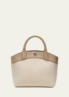 "Find SAVETTE Tondo Canvas Tote Bag on Editorialist. The Savette \"Tondo\" tote bag is crafted from canvas cotton and leather. It features top handles and an open top with a magnetic closure. The interior includes one zip pouch. It measures approximately 8.5\"H x 10\"W x 5\"D and is made in Italy." Round Canvas, Small Canvas, Zip Pouch, Open Top, Black Canvas, Black Tote Bag, Canvas Tote Bag, Leather Top, Magnetic Closure