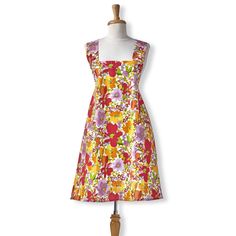 a dress on a mannequin with an orange and pink floral print, front view