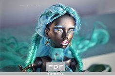 an image of a doll with blue hair and make - up on it's face