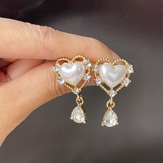 Romantic princess style fancy heart shape chunky white pearl stud earrings with 14K gold plated lace and teardrop cz dangle drop, super cute and luxurious! Unique design will bring you lots of compliments on every occasion, perfect bridal bridesmaids bridal wedding earrings. Handmade of 925 sterling silver, hypoallergenic and good for sensitive skins. ♥ All of our jewelry are carefully handmade with delicate and exquisite details, all designed and made in Manhattan, New York. 💎 Features: ♥ Hand Luxury Heart Earrings For Wedding, Luxury Handmade Pearl White Earrings, Luxury Pearl White Teardrop Earrings, Luxury Teardrop Pearl White Pearl Earrings, Luxury Romantic Heart Earrings For Wedding, Luxury Delicate Pearl White Earrings, Luxury Sterling Silver Heart Earrings For Wedding, Luxury Pearl White Statement Pearl Earrings, Heart-shaped Romantic Earrings